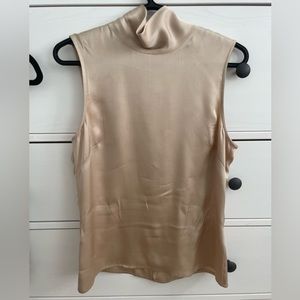 ANINE BING
Katie silk-charmeuse turtleneck top.